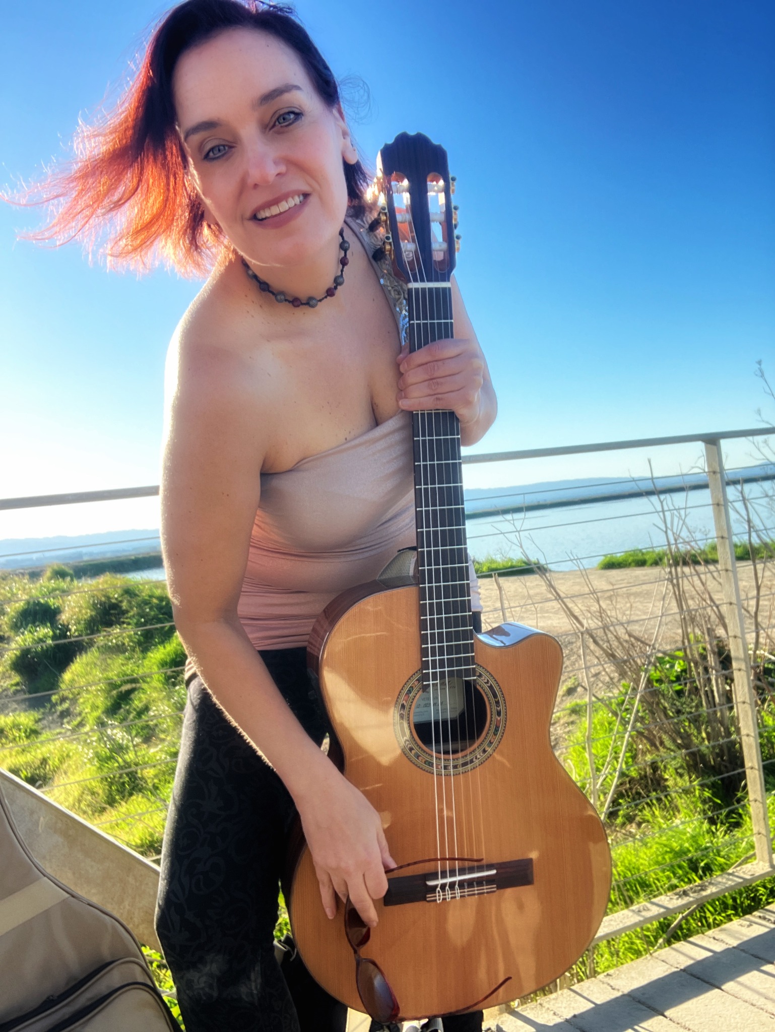 Nicolaia with her nylon-string guitar